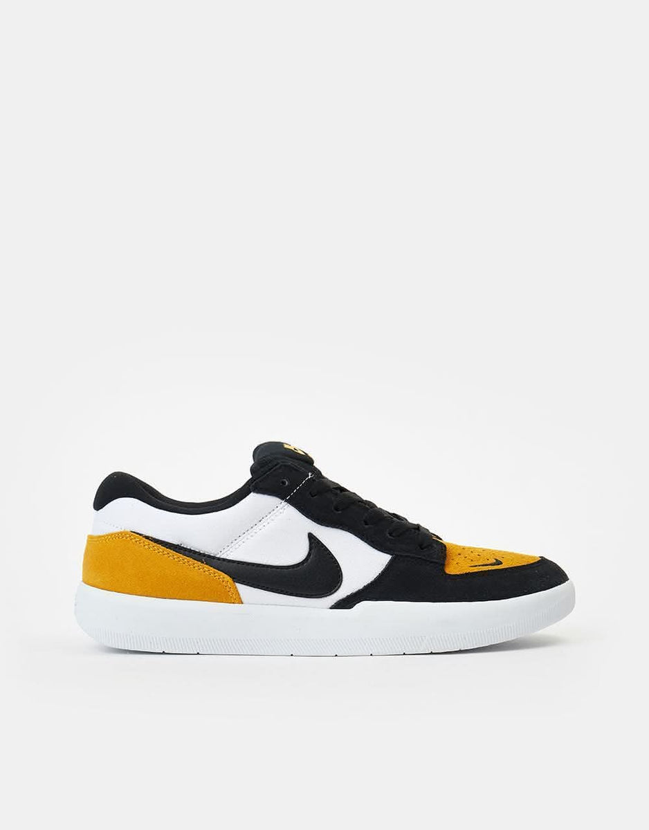 nike gold black white