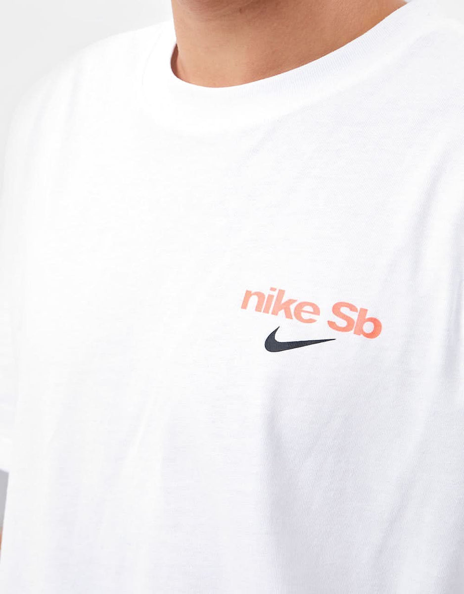 white nike shirt with orange swoosh