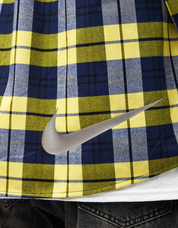 yellow and navy blue nike shirt